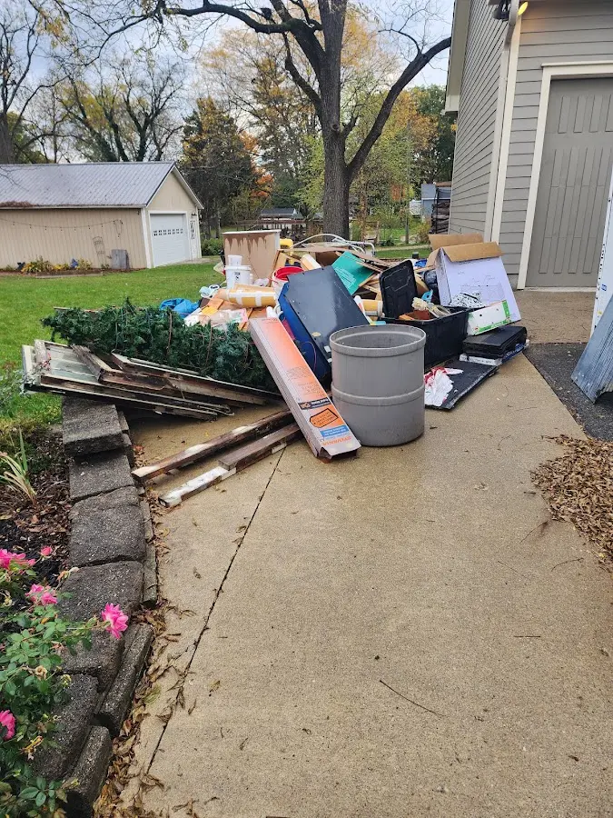 Dumpster being loaded with debris for Demolition Dumpster Rental in Barre